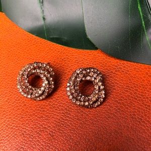 Pale pink statement earrings.